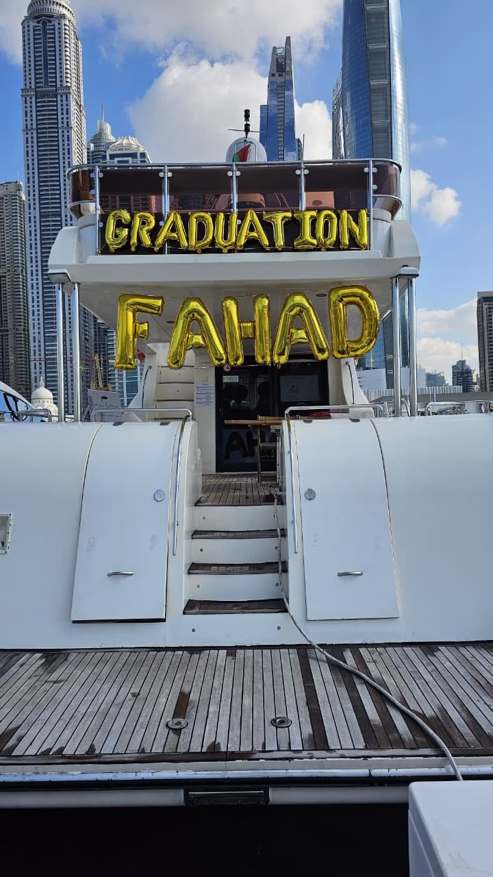 Graduation yacht party Dubai skyline view